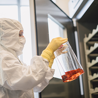 Gowned operator in the Spark Therapeutics gene therapy manufacturing facilities