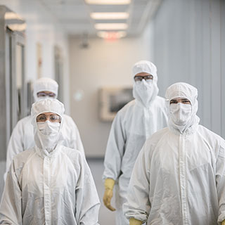 Gowned operators in the Spark Therapeutics gene therapy manufacturing facilities
